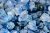 pile of rough-cut blue gems precious stones